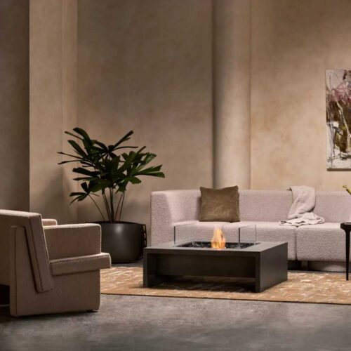 Modern rectangular fire pit table in a warm natural finish in a contemporary living room.