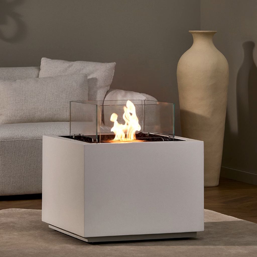 Square fire pit table in a clean bone finish on a white background