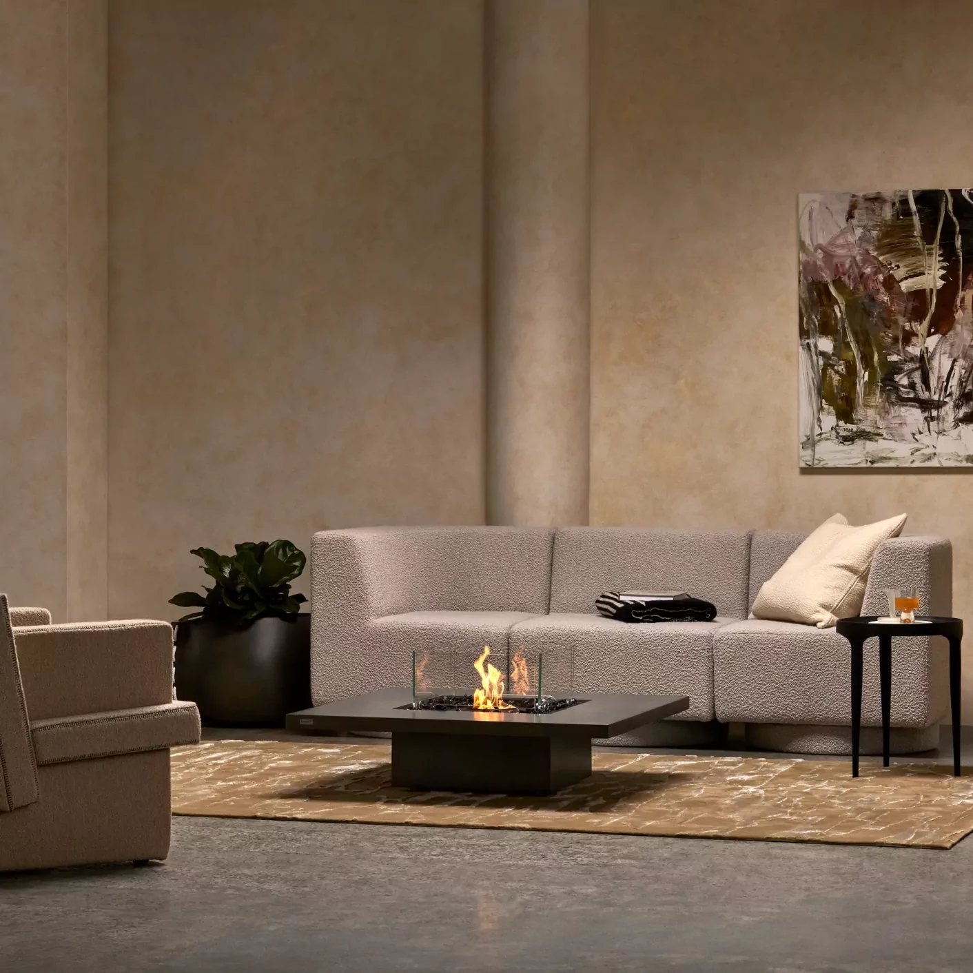 Contemporary patio setup with low-profile fire table in Graphite finish