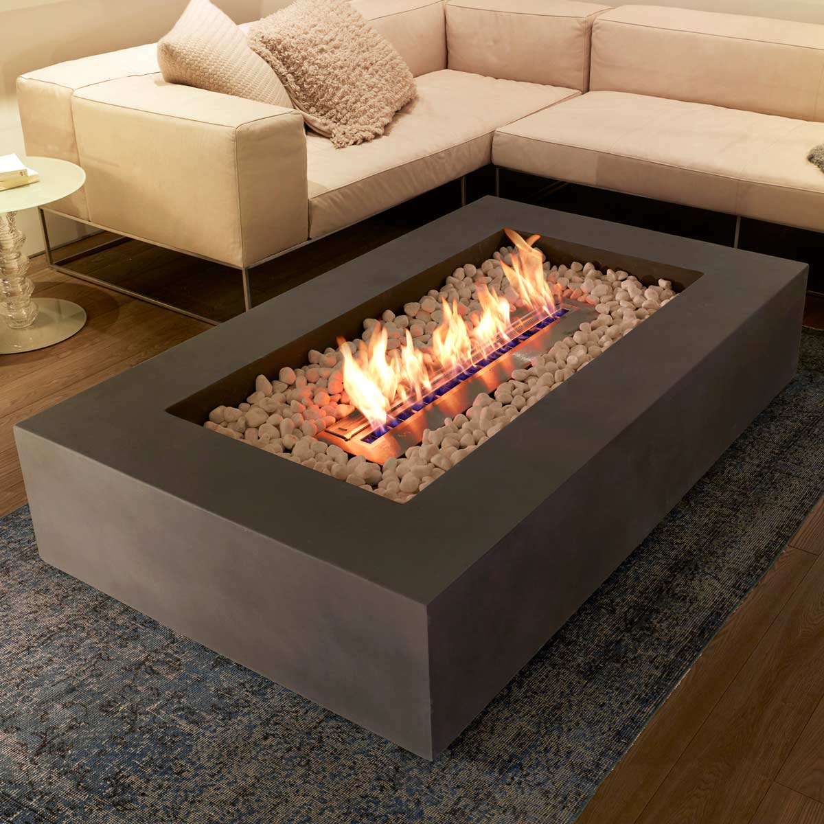 Rectangular outdoor fire pit table with glowing media